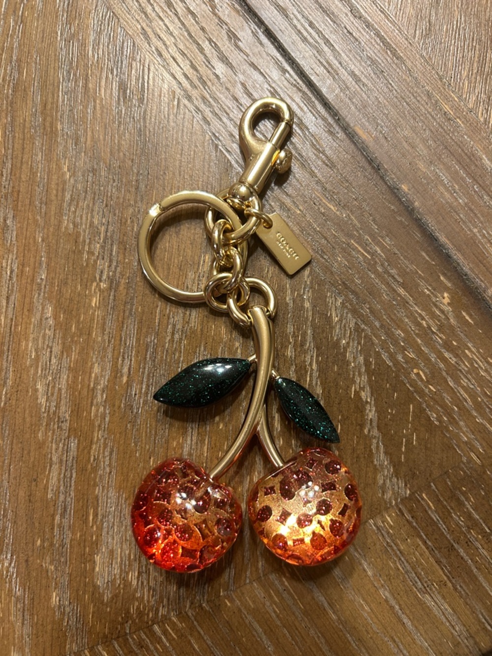 Coach Gold Signature Pink Glitter Cherry Keychain with Dark Green Leaves
